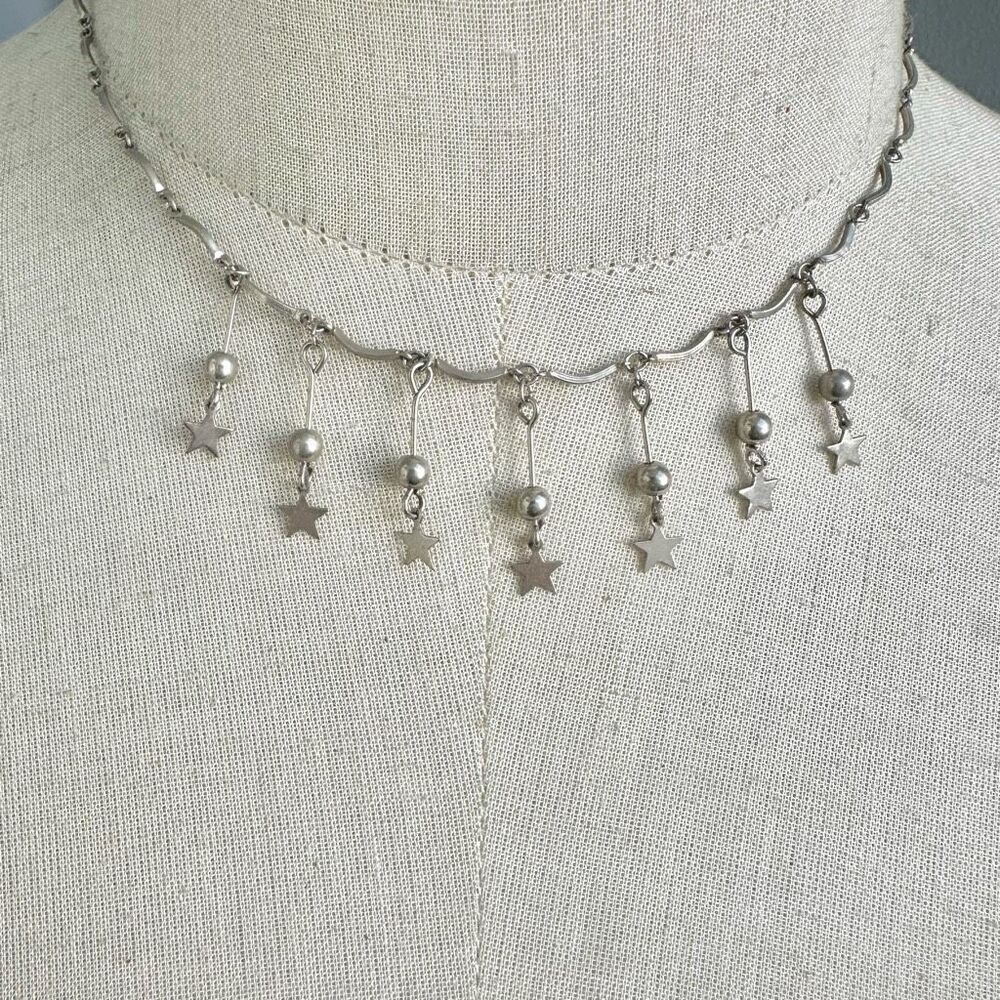 Silver tone hanging star choker necklace